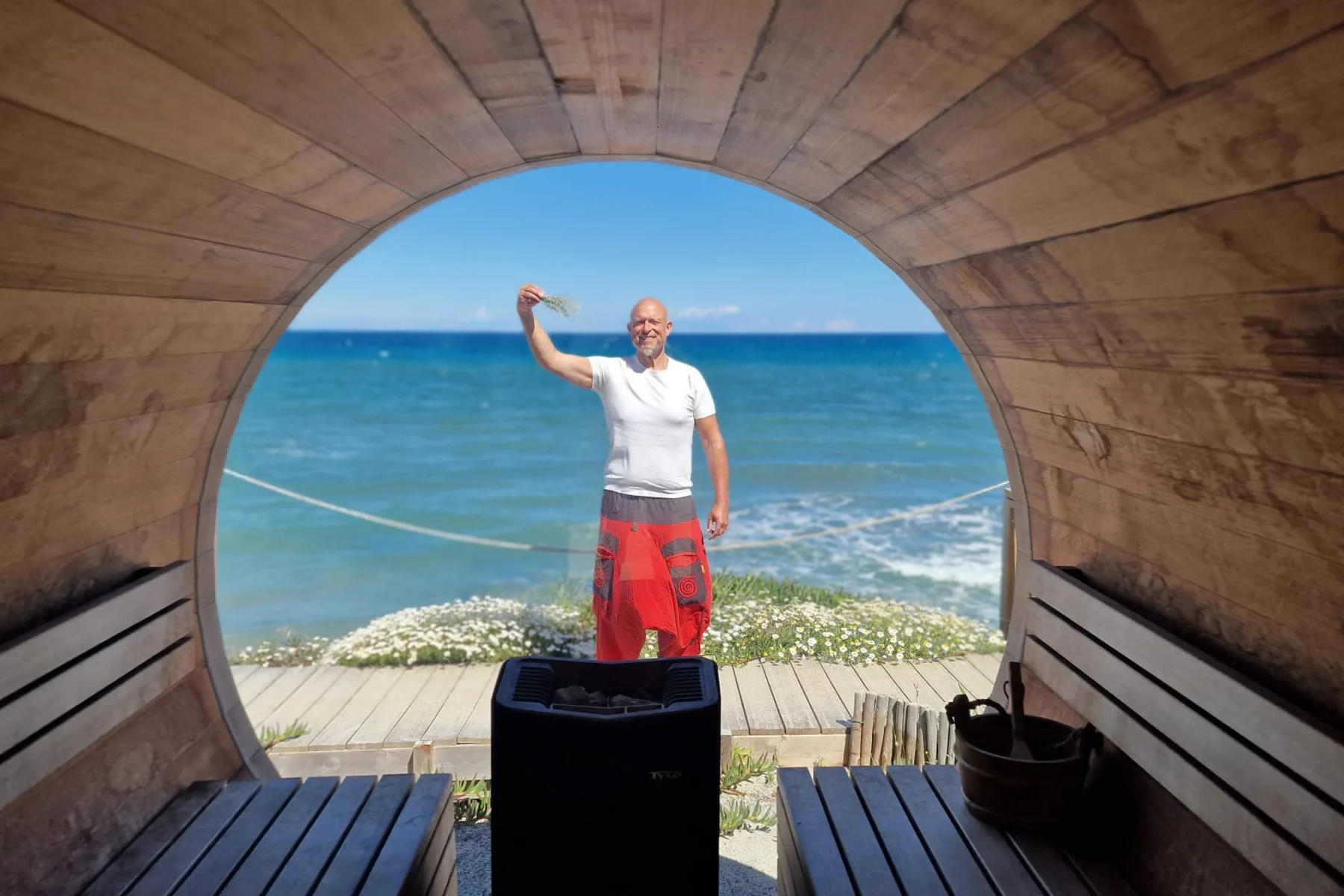 View from a sauna with sea and infusion bucket